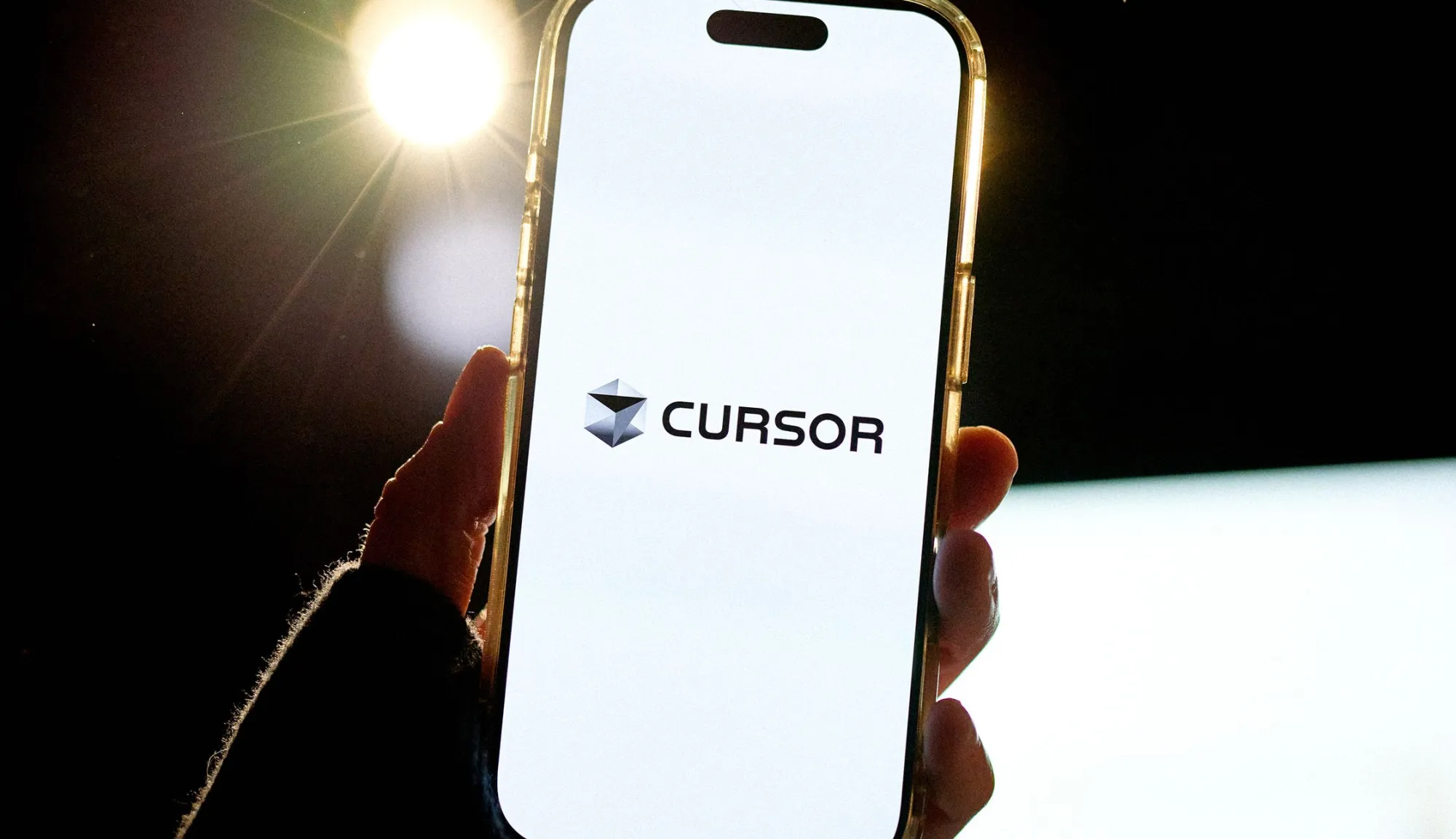 The Cursor logo on a phone screen
